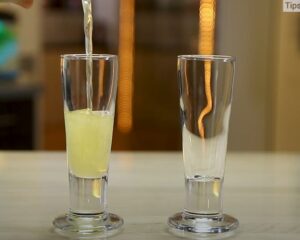 Strain Liquid into Two Shot Glasses