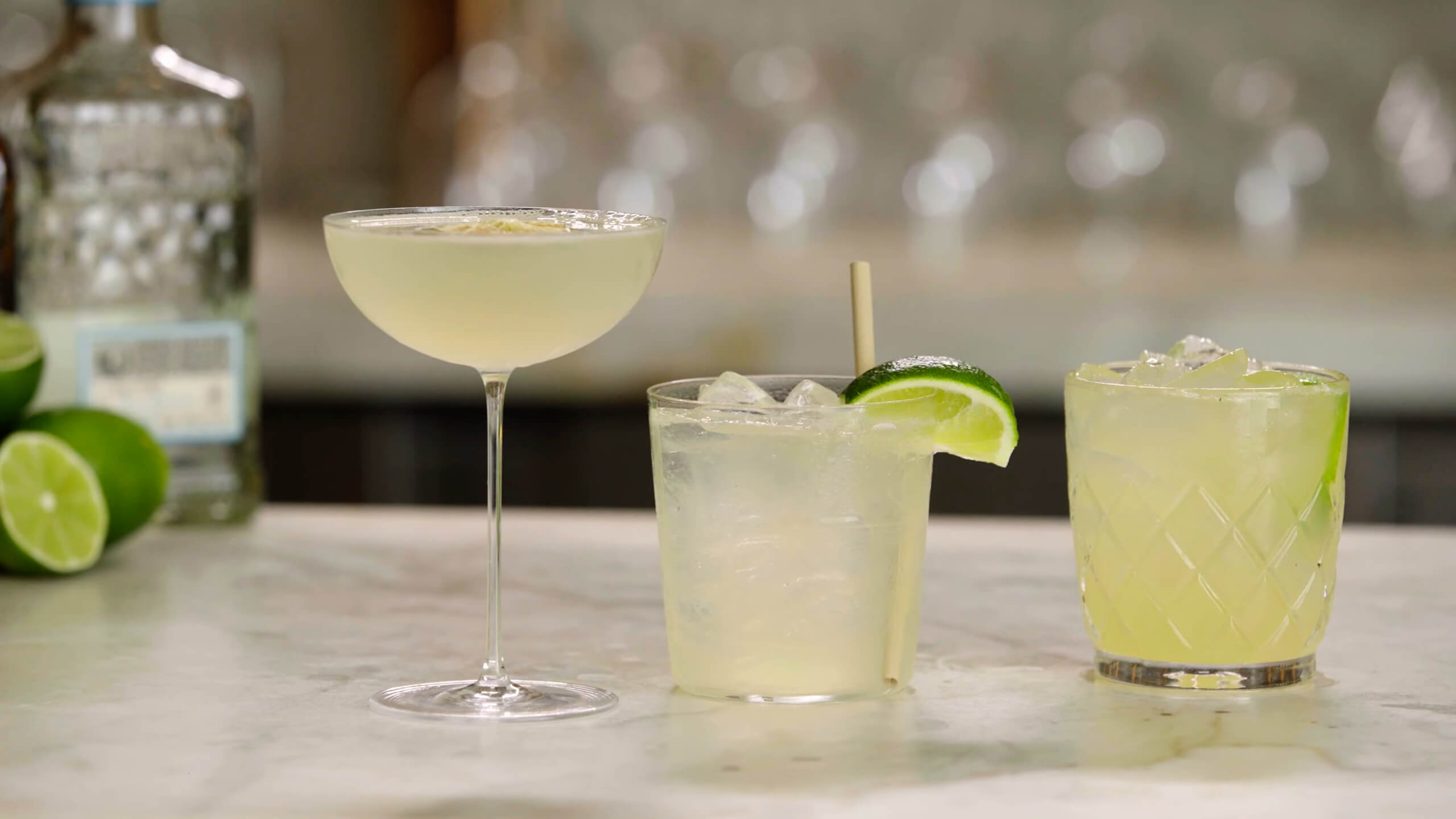 Three cocktails with ice in glasses