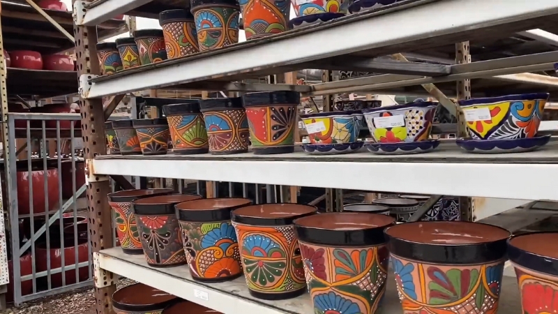 Shelves Filled with Colorful Talavera and Talavera-Style Pottery Planters