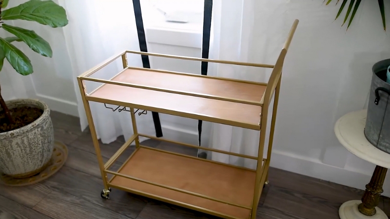 Minimalist DIY bar cart with gold metal frame and clean wood shelves, ready for styling and final decor touches